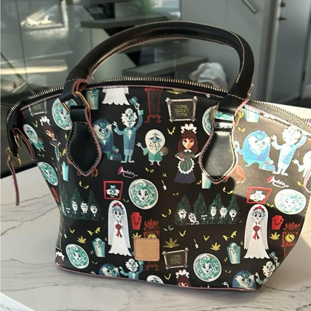 Halloween themed purse.  Man made materials.  Based on the Haunted Mansion.